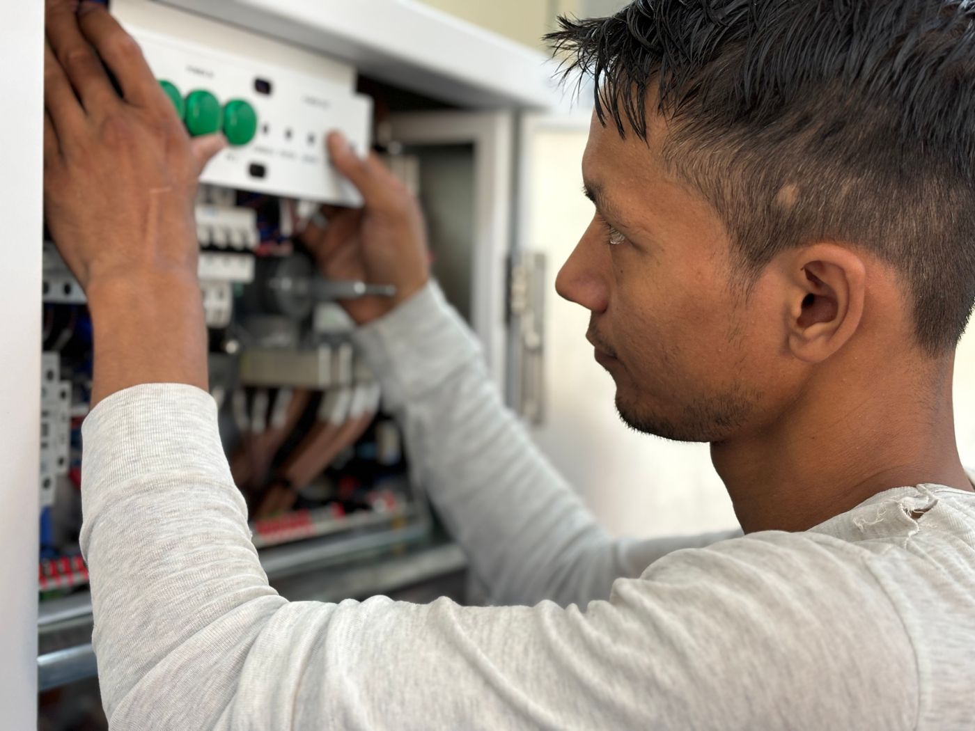 Electrician working on a panel